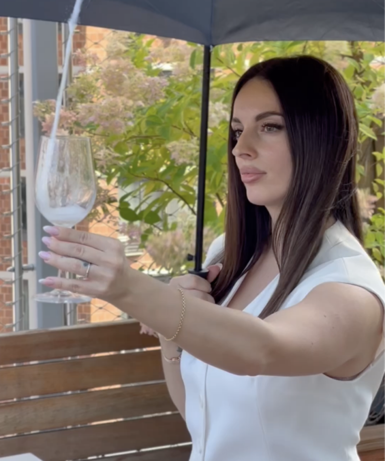 Tati from LA filming a rooftop wine and dining video