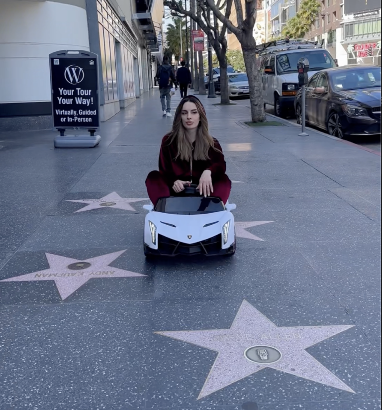 Tati from LA filming comedy content on the Hollywood Walk of Fame